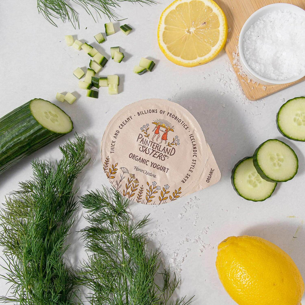 Painterland Sisters organic skyr yogurt next to sliced cucumber and lemon