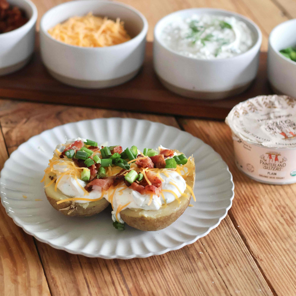 Loaded Baked Potatoes with Creamy Garlic and Herb Skyr Topping